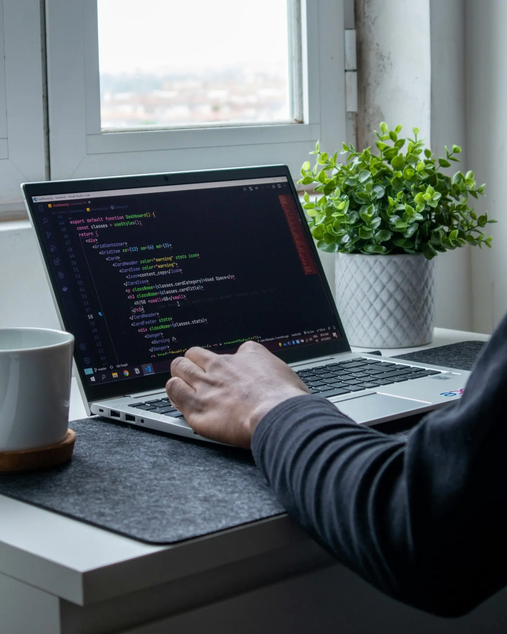 Developer coding on a laptop